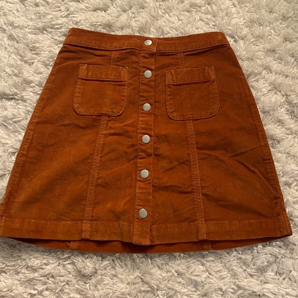 For my 70s style babes! UO burnt orange mini skirt…front pockets and buttons!!